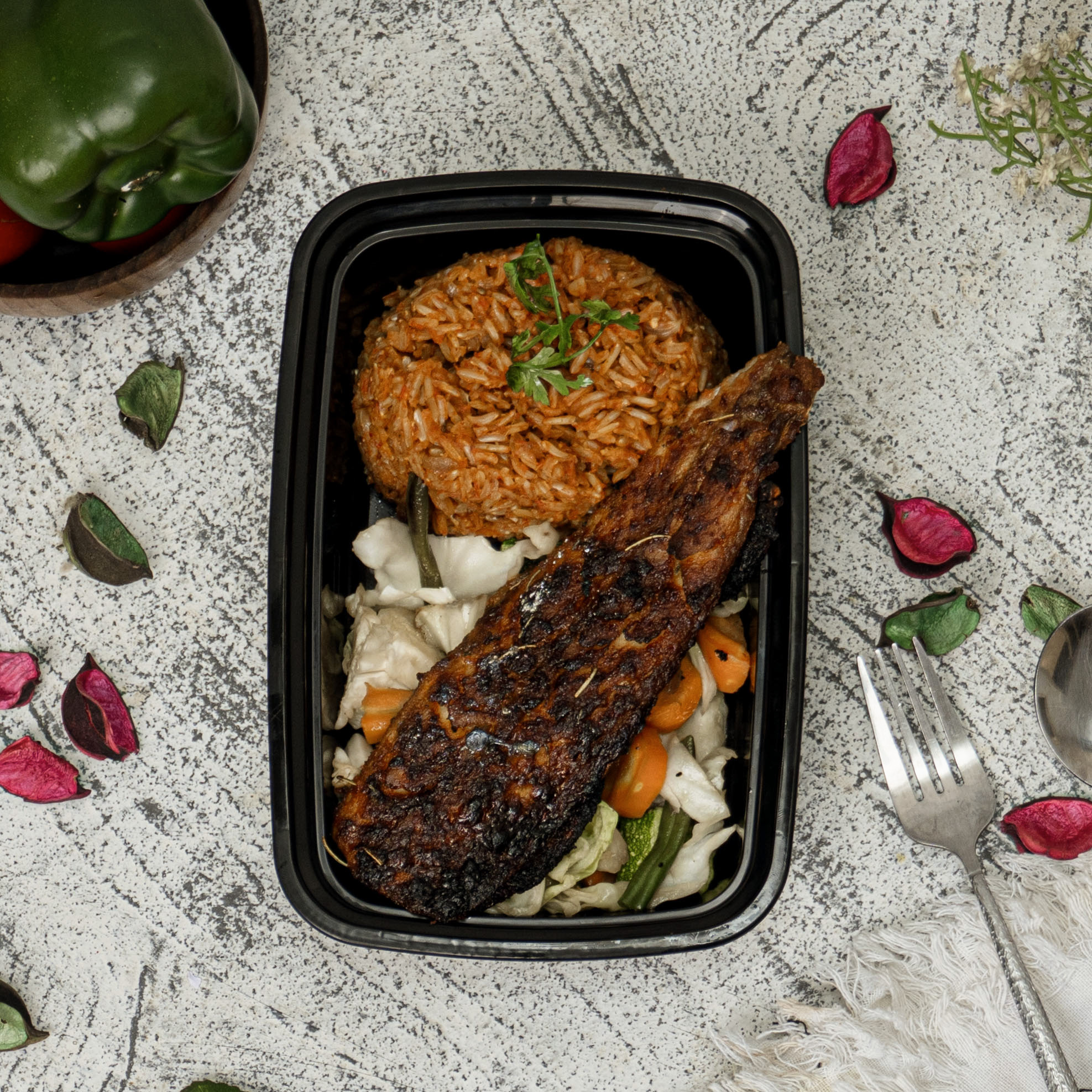 Jollof Brown Rice with Grilled Titus Fish Fillet & Stir fry Vegetables